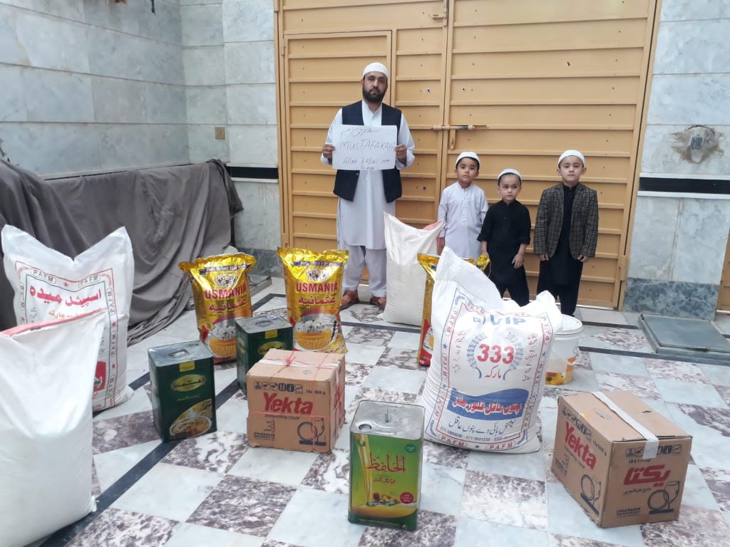 Distribution of food items to poor children by Rahman Aid